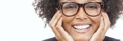 woman wearing glasses smiling