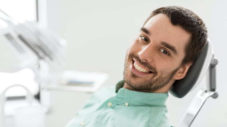 Man smiling in dental chair